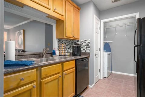 Well‑appointed kitchen stocked with everything you need — Keurig with coffee pods, drip options, double‑basin sink, dishwasher, fridge/freezer, oven, stove, microwave, toaster, and Instapot. Plus, laundry access!