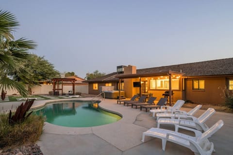 Enjoy resort-style living with a crystal-clear pool and spacious outdoor lounge perfect for your getaway.