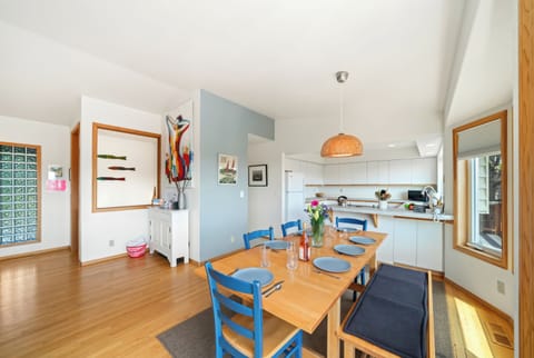 First floor with 3 bedrooms, kitchen, dining, living area, and access to outdoor space and garage. 
Living room with pellet stove, streaming TV. Kitchen with lots of counter space and storage.