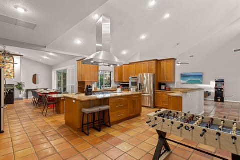 Cook, dine, and play without missing a beat, this open space brings warmth, fun, and connection to your stay.