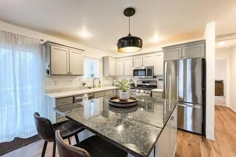 Zoomed in view of the kitchen and island. 