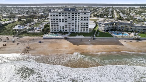 The 9th floor unit is located in the Aquarius Oceanfront Condominium building.