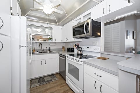 The fully equipped kitchen features a new dishwasher and toaster.