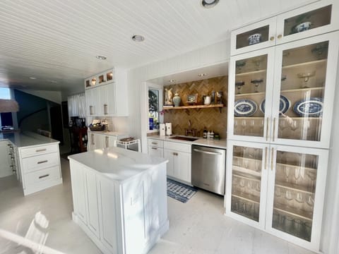 Custom Zellige tile, brass kitchen faucet