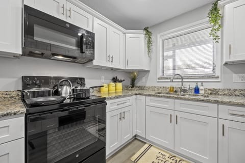 Bright and open fully equipped kitchen where it will be a delight to share meals and moments with family.