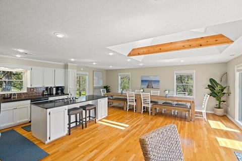 Kitchen has huge dining table and seating for all guests.