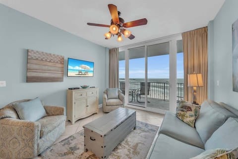 The Living Room seamlessly opens onto the expansive balcony, offering a panoramic view of the Beautiful Blue-Green waters of the Gulf of Mexico and the White Sugar Beaches of Gulf Shores.