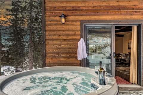 Enjoy the hot tub off of the main great room space, additional seating and grill also in this area.