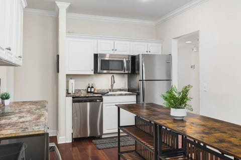 Fully-stocked kitchen with all the appliances & utensils you'd need to prepare a meal.