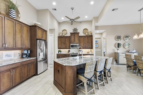 Gorgeous Gourmet Kitchen with Stainless Appliance and Adjoining Dining Area