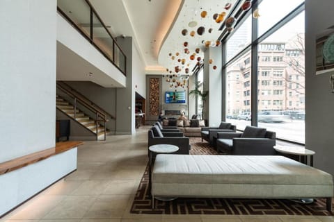 Stretch out on sleek seating in the expansive, modern lobby