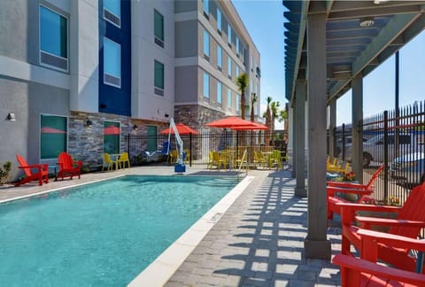 Gather poolside under umbrellas for relaxed chats and sunshine.