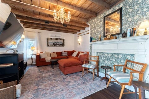 Old carriage house area converted into beautiful & cozy living room with 70" smart TV