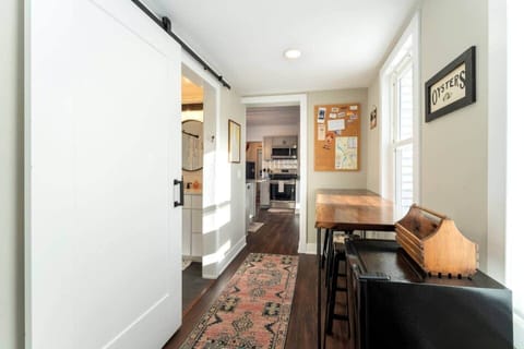 Hallway with breakfast nook, stools and mini fridge