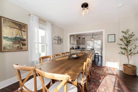 Our 12 person dining room table, decorated with authentic Maine artwork
