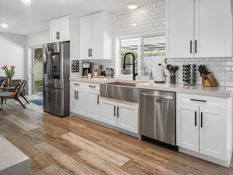 Smart stainless appliances, coffee station, beverage fridge round out the functional luxury.