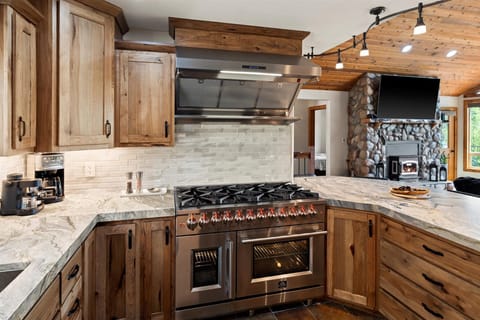 New 48" double oven, 8-burners with warming shelf.