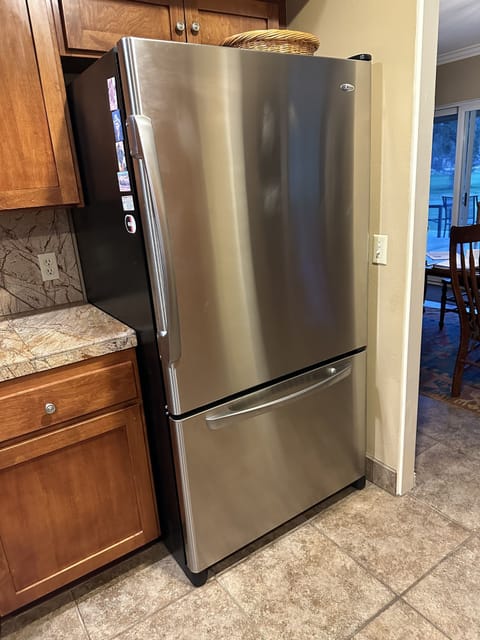 Large modern fridge, cold water dispenser inside