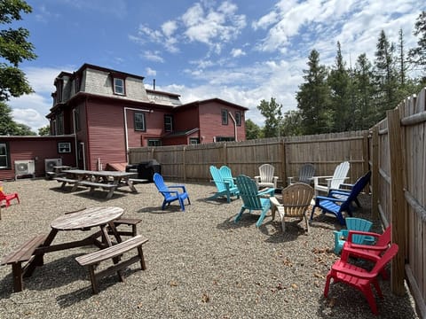 1 of 2 outdoor amenity spaces! We have 2 firepits, BBQs, Adirondack chairs, fire starter, fire wood, games and more!