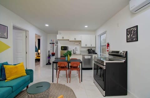 Ditch the cookie-cutter hotel room and enjoy a living space with bright colors, abstract artwork and personality plus the convenience of a fully equipped kitchen!