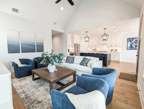 Open concept design with vaulted ceiling and lots of natural light flows through the living spaces.