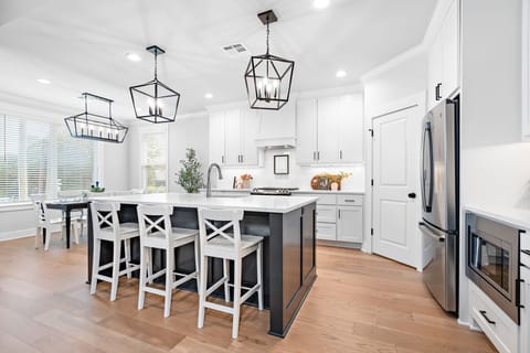 In addition to dining, the kitchen island provides additional dine-in seating.