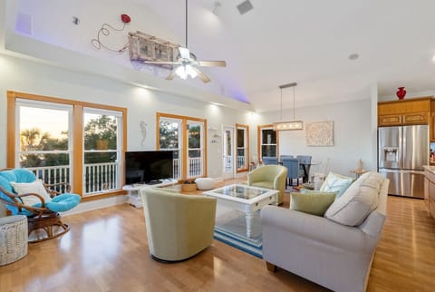 Living room upstairs with windows on 3 sides for an abundance of natural light