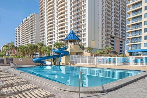 Splash and play in the family-friendly pool with slide.