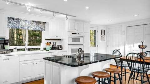 Our spacious kitchen is fully equipped with all cooking and dining essentials.