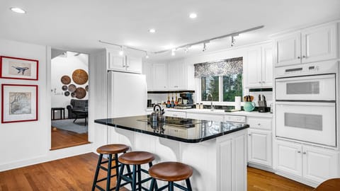 Our spacious kitchen is fully equipped with all cooking and dining essentials.