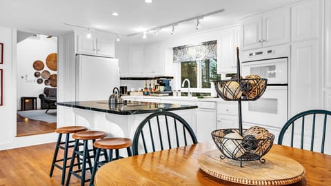 The secondary dining table in the kitchen seats four comfortably.