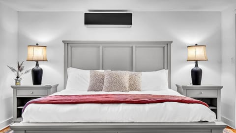 King bedroom - equipped with a dresser, a closet and an ensuite bathroom.