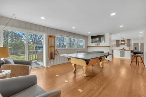 Ping pong and pool table and a 55 inch smart TV