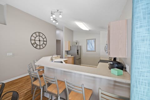 The kitchen bar has additional seating.