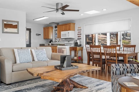 Dining Area: Gather around the dining table for a meal or enjoy a show on the TV in our open-concept living space.