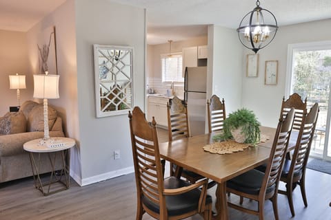 Good size dining table with 8 matching chairs and extra leaves available