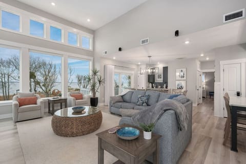 Open living space w/ comfy seating, bright windows & an easy coastal flow.