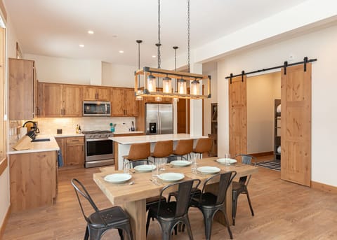 We have ample dining space at the table and kitchen island, as well as a fully stocked kitchen