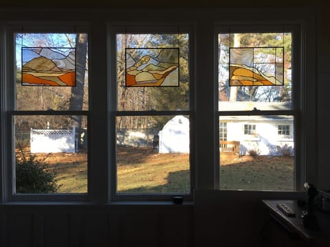 Lovely stained glass windows by property manager/artist Rosemary Brown.