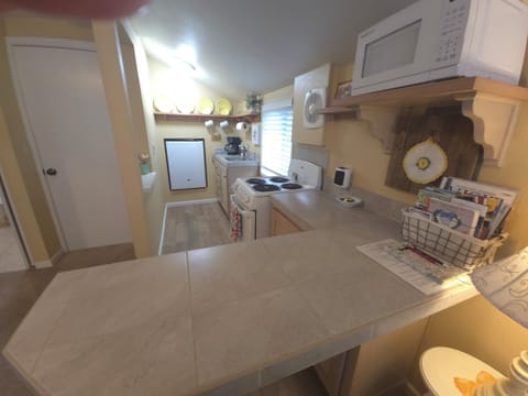 Full kitchen with all utensils.