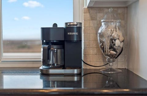 Coffee station with espresso machine and countertop setup for morning convenience.