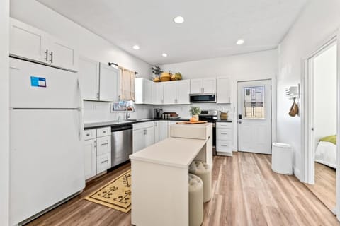 Bright and spacious kitchen with modern appliances and a cozy island.