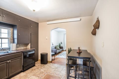 Gather around the inviting dining table and indulge in memorable meals and engaging conversations. The dining table at 'The Quaint Quarter' provides a comfortable and stylish space to enjoy delicious food and create lasting memories.