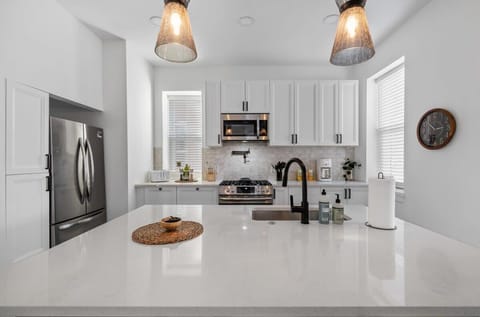 Feeling like a master chef in this spacious kitchen with a large, pristine white countertop! ✨ #KitchenGoals #DreamKitchen #CookingInStyle