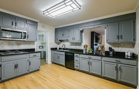 Organized kitchen with cooking basics and storage. Perfect for short or extended stays.