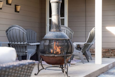 Fabulous outdoor space with large fire pit, chimney, seating area and outdoor dining area. Fully fenced for your pets as well (and we even have a doggie door)