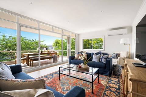 The living area is the perfect entertainment space with a large screen TV and cosy lounges to enjoy a movie, book and each other's company.
