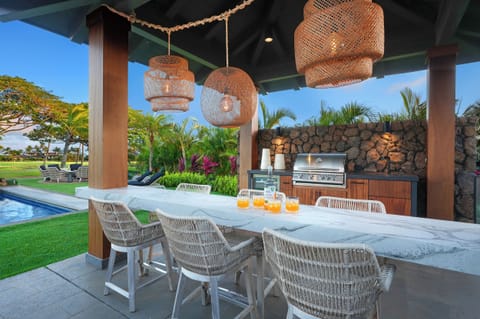 Grab a seat the tropical poolside bar and grill setup for your end of day recap.