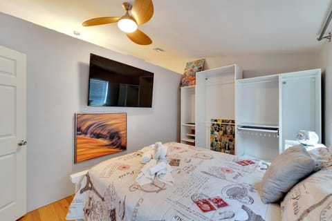 Bedroom #1: Queen-sized bed with smart tv and storage for clothing 