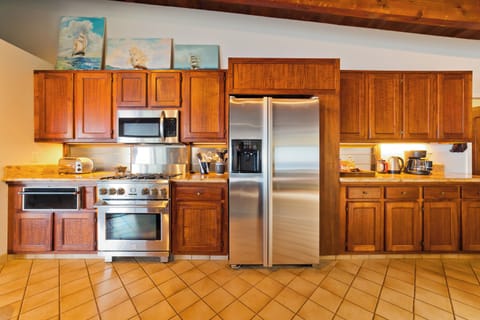 Chef's kitchen with high end appliances and amenities. The koa wood cabinets are spellbinding. Chef's kitchen with high end appliances and amenities